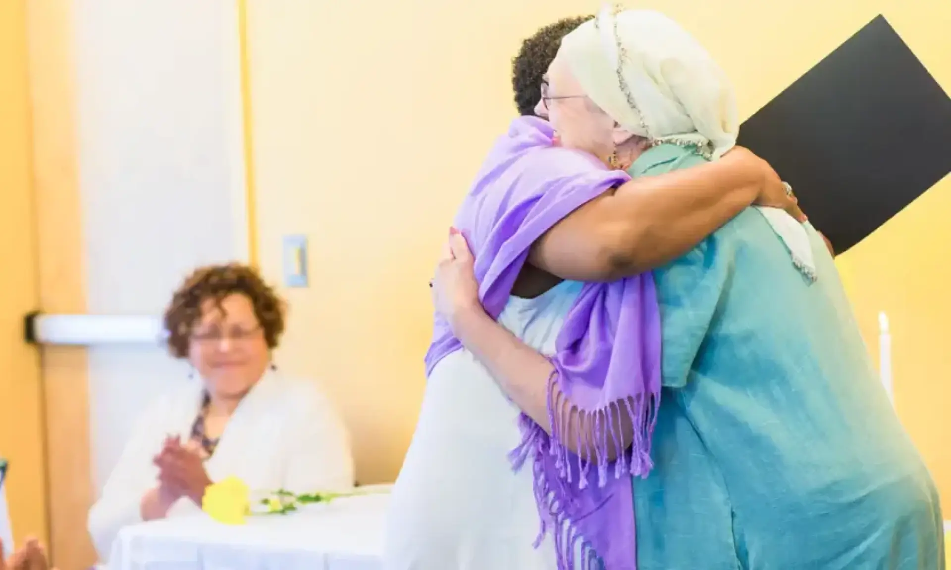 A graduate receiving recognition at the NSSC spiritual graduation ceremony.